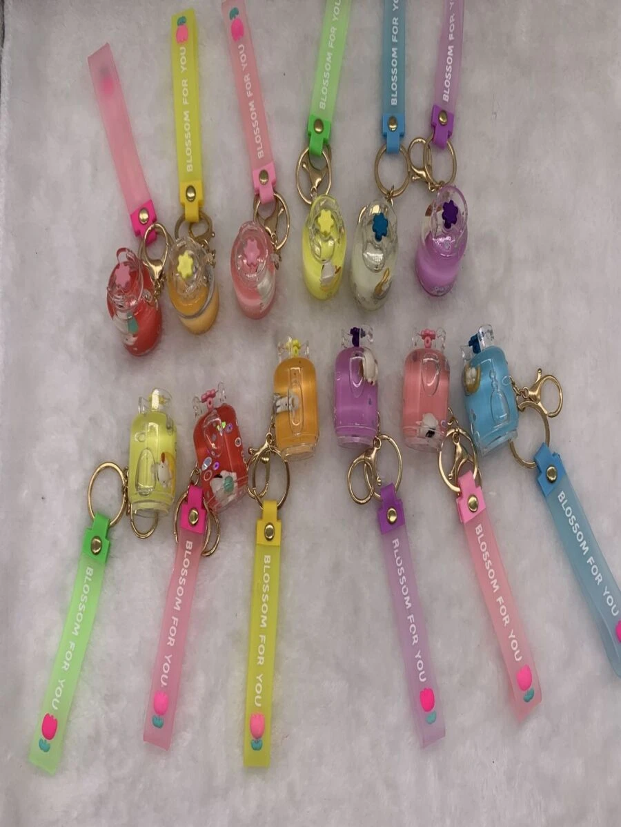 12 UNIDADES CHAVEIROS: Chaveiros de acrílico com Liquído e alça de silicone. / 10-6