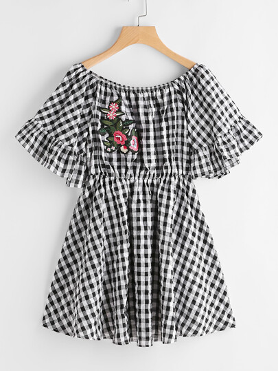 Vestito a quadretti con applique ricamato