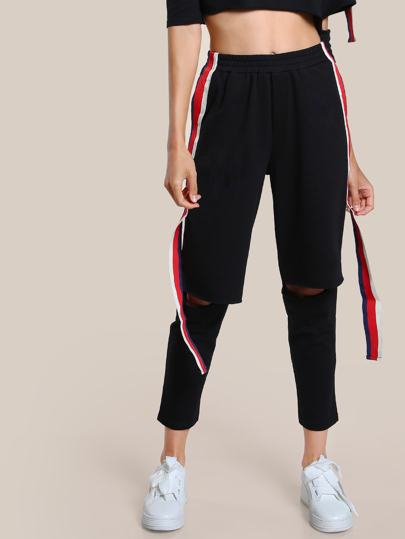 Pantalones de rodilla descubierta con cinta lateral de rayas