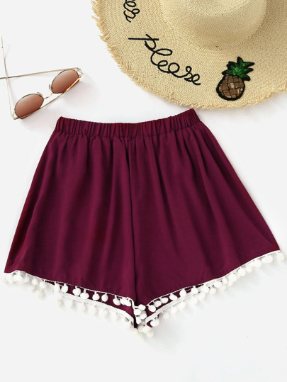 Short con bajo con pompones