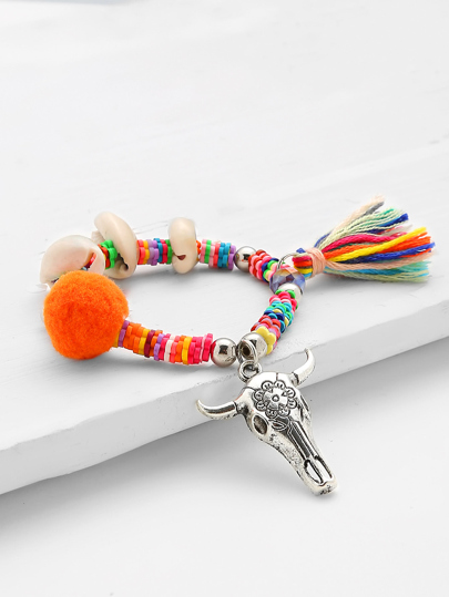 Bracelet avec coquille et franges
