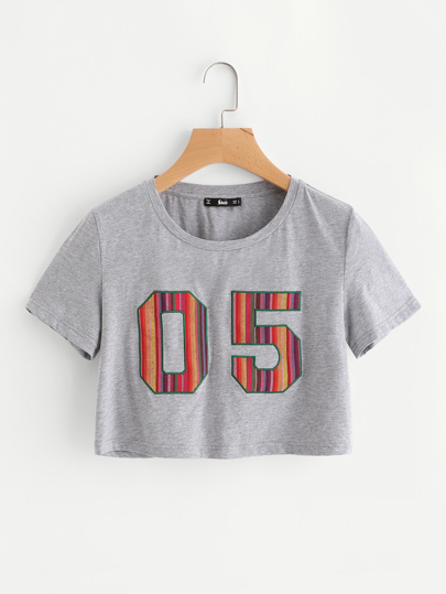 Camiseta corta con detalle de parche