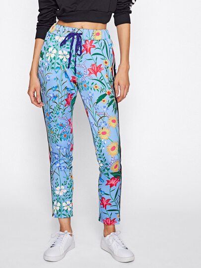 Pantalones de rayas verticales con estampado botánico