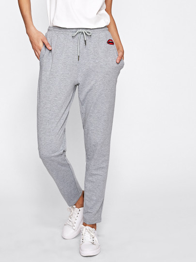 Sweat-pantalons brodé de la lèvre en tricot