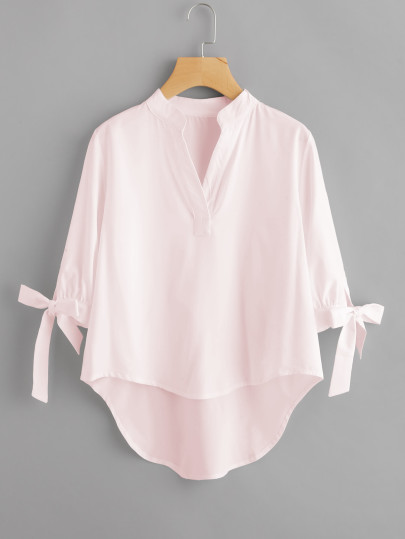 Blouse avec pan asymétrique avec lacet de manchette