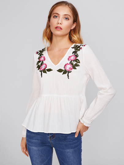 Bluse mit Stickereien und Blumen Flicken