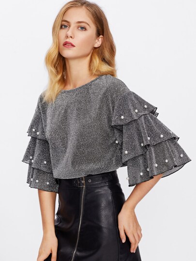 Top avec perle avec manche stratifié