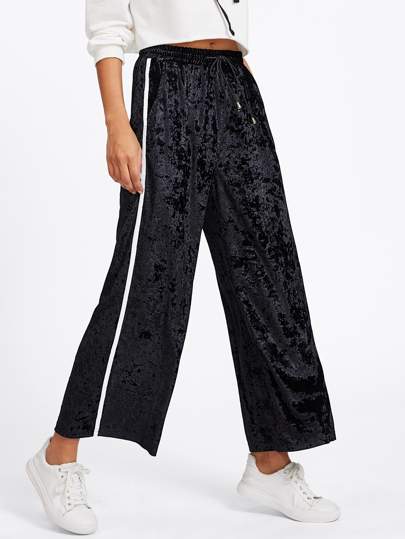 Pantalons en velvet avec cordon de taille rayure côté