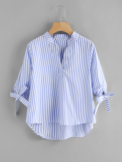 Blouse avec pan asymétrique avec lacet de manchette