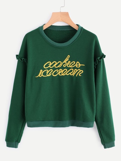 Pull découpé brodé des lettres avec des plis