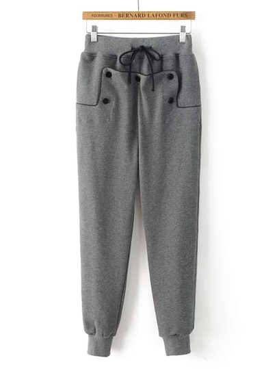 Pantalones con detalle de botón y cordón
