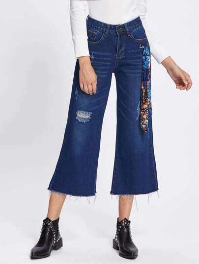 Jeans avec jambe gros avec pan déchiré