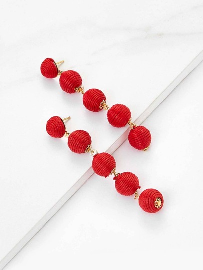 Tropfenohrringe mit Pompons Design