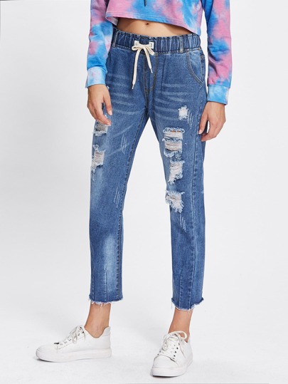 Jeans avec cordon avec pan déchiré