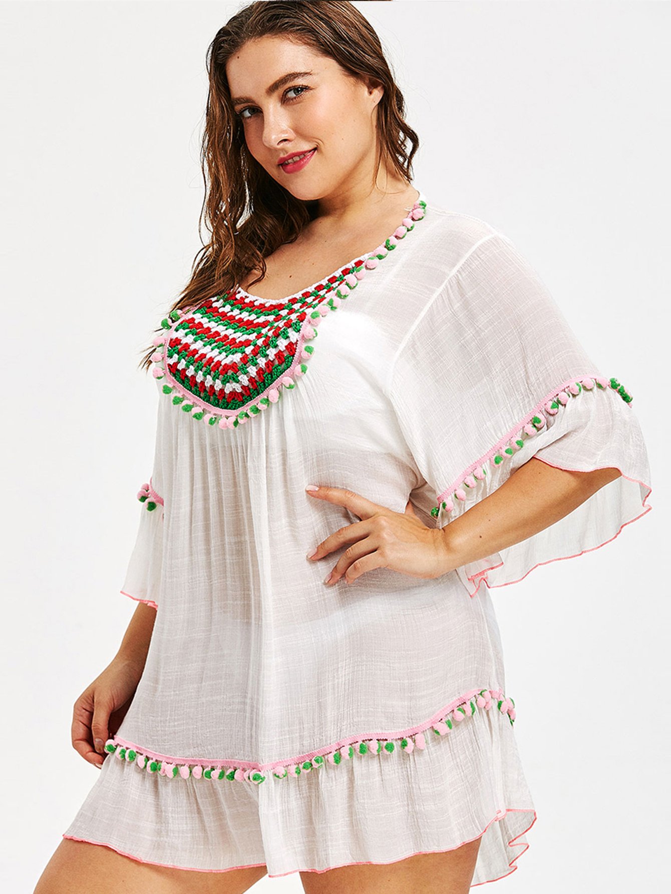 Накидка с вязаными панелями и помпонами