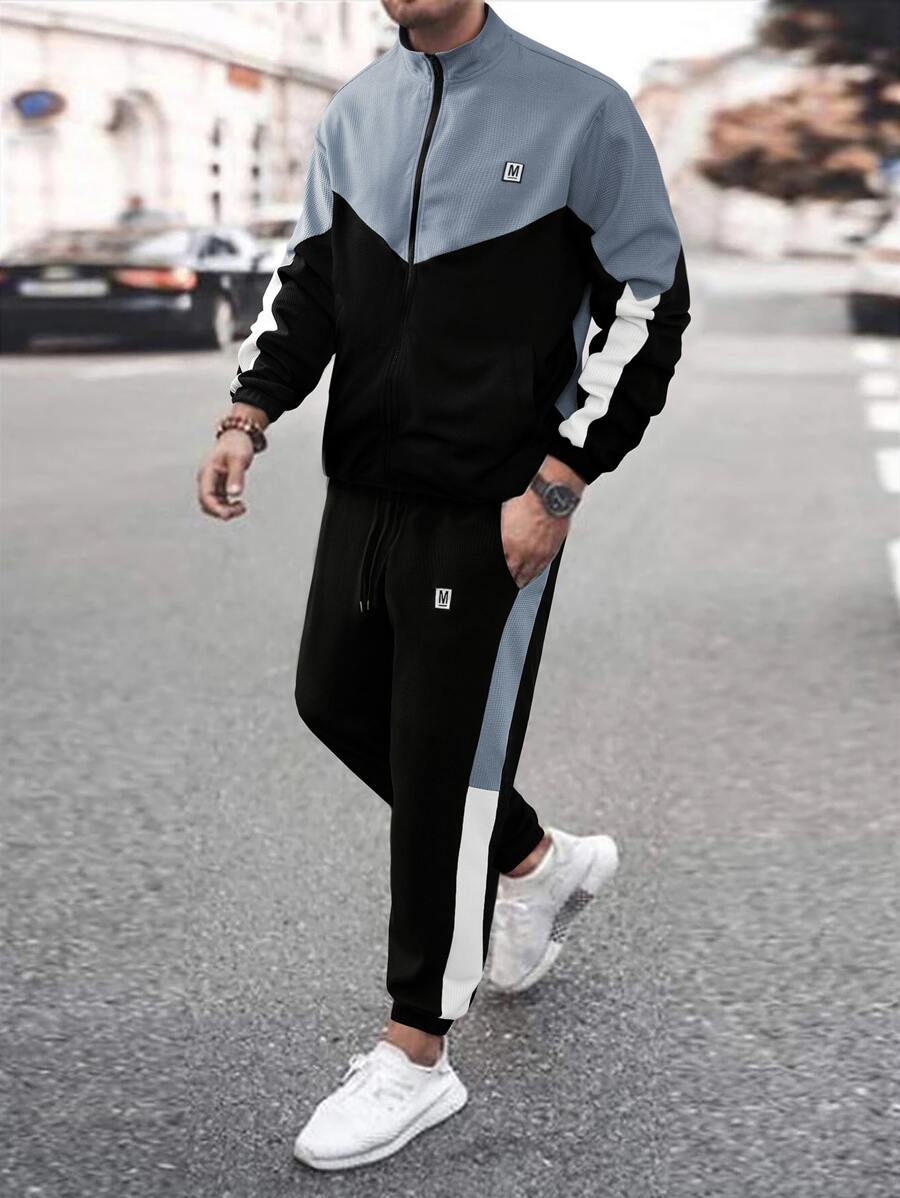 Manfinity Homme Hombres Cazadora de color combinado con parche de letra con cremallera con pantalones deportivos