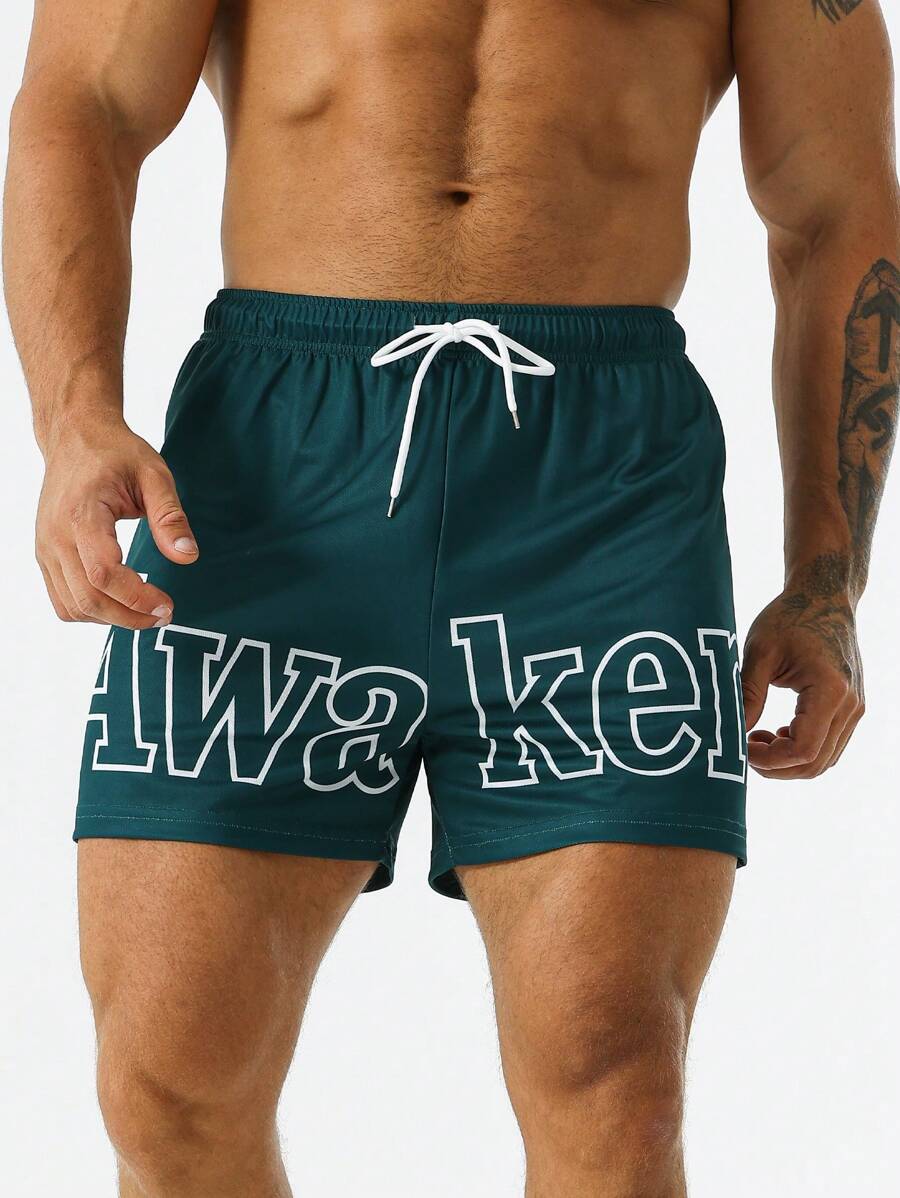 Street Sport Men Letter Graphic Drawstring Waist Slant Pocket Shorts