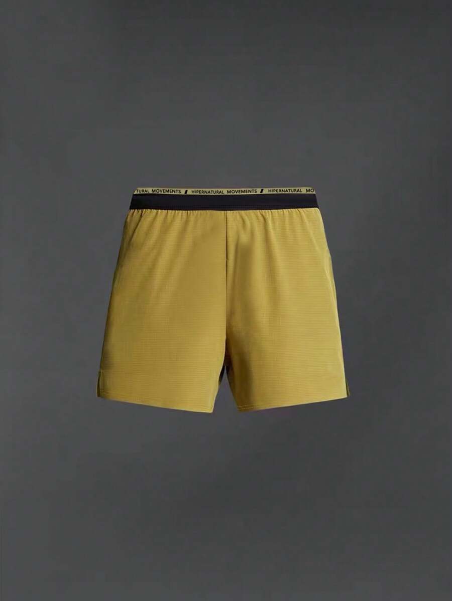 Manfinity Sport Corelite Herren Sport Shorts mit Buchstaben Muster und Kordelzug, Gelbe Jogger Shorts