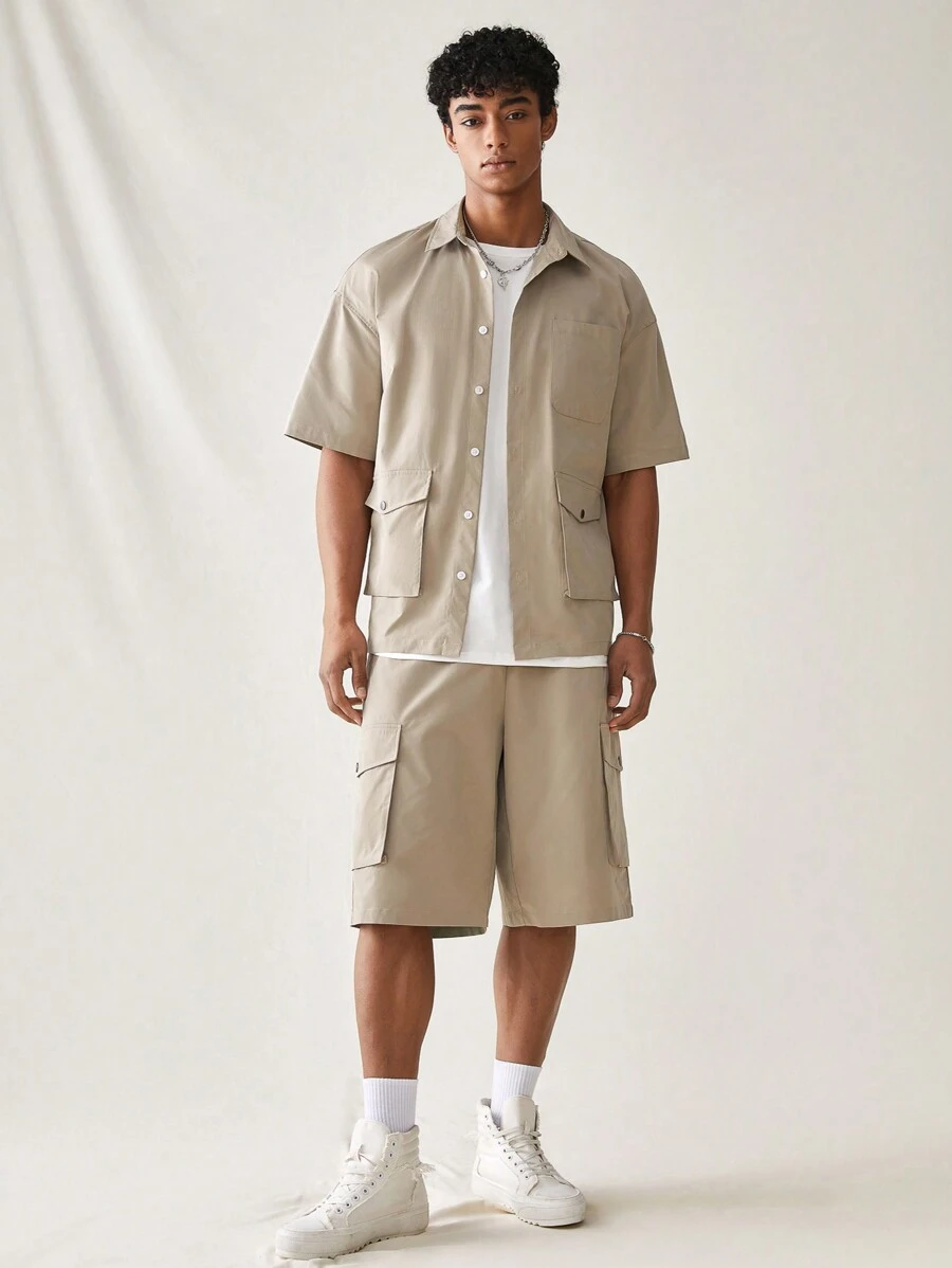 Manfinity RebelGame Set casual da 2 pezzi composto da camicia a maniche corte e pantaloncini in tessuto tinto unito, adatto per l'estate, amici, città