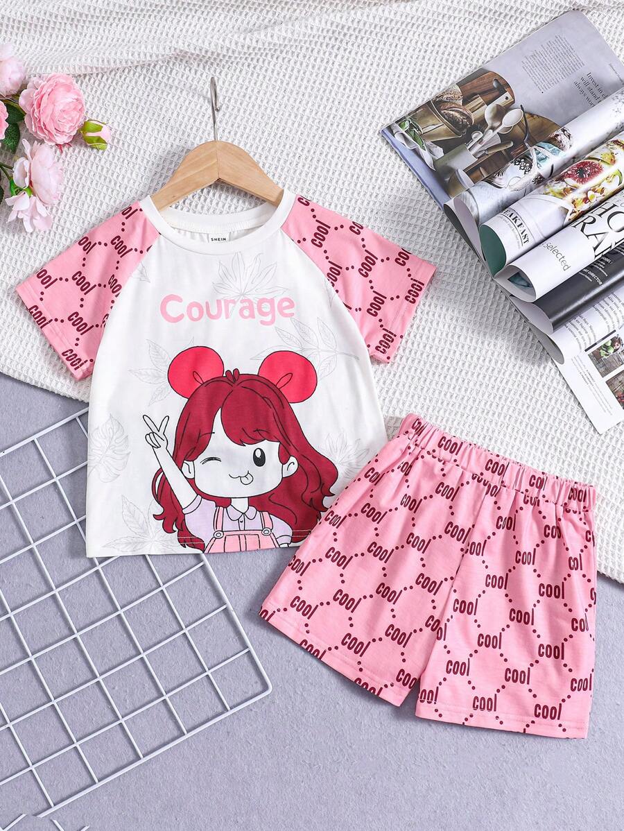 SHEIN Conjunto de pijama cómodo informal y lindo para niña joven con patrón de dibujos animados en la parte superior de manga raglán corta y shorts