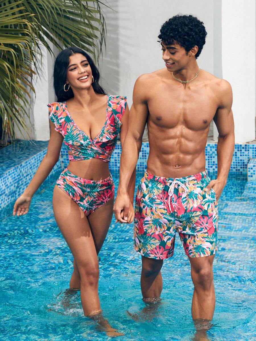 Manfinity 1 pieza Pantalón corto de verano de hombre con estampado de hojas sueltas, traje de baño a juego para parejas, vacaciones estilo hawaiano