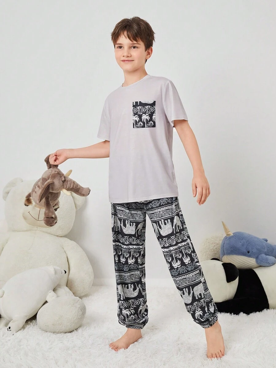 SHEIN Tween Boy Tween Girl Vintage Pattern Print Short Sleeve Top And Long Pants Knit Comfortable Casual Sleepwear Set With Pockets And Flame Retardant Features
