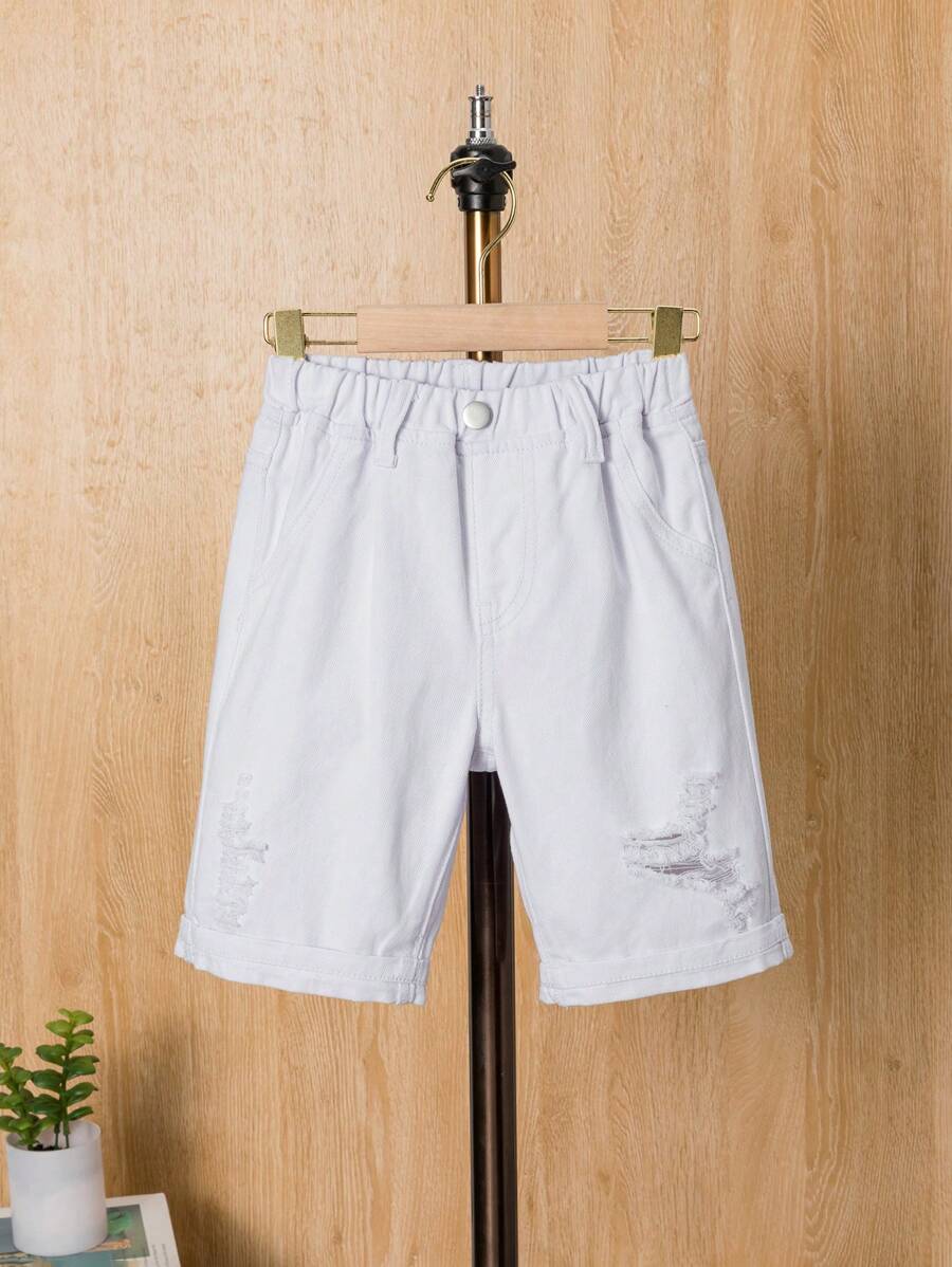 Shorts de mezclilla holgados y desgastados para niño joven en verano
