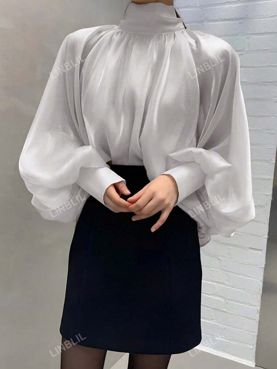 Elegante blusa suelta de manga larga con cuello alto y manga de globo en unicolor para mujer, ideal para primavera y otoño