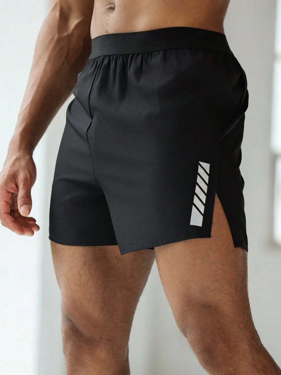 Manfinity Sport Corelite Boyfriend-Stil Herren Grafik Muster Elastische Taille Spalt Saum Sport Shorts, Sommer Schule