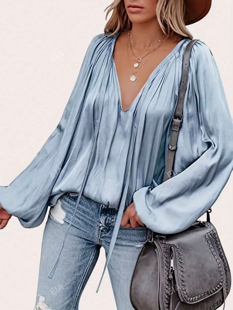 Camicia elegante da donna con scollo a V, cintura anteriore a pieghe e maniche lunghe con stile raffinato