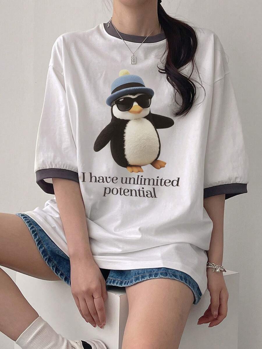 DAZY Camiseta casual de mujer de manga de hombro caído con estampado de dibujos animados de verano y parche con eslogan "Tengo un potencial ilimitado"