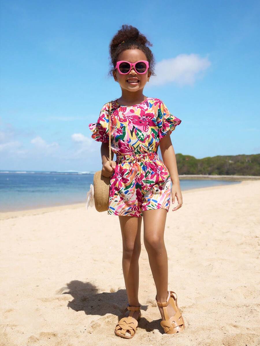 SHEIN Conjunto de top holgado con volantes y hombros descubiertos y pantalones cortos estampados de vacaciones para niñas jóvenes