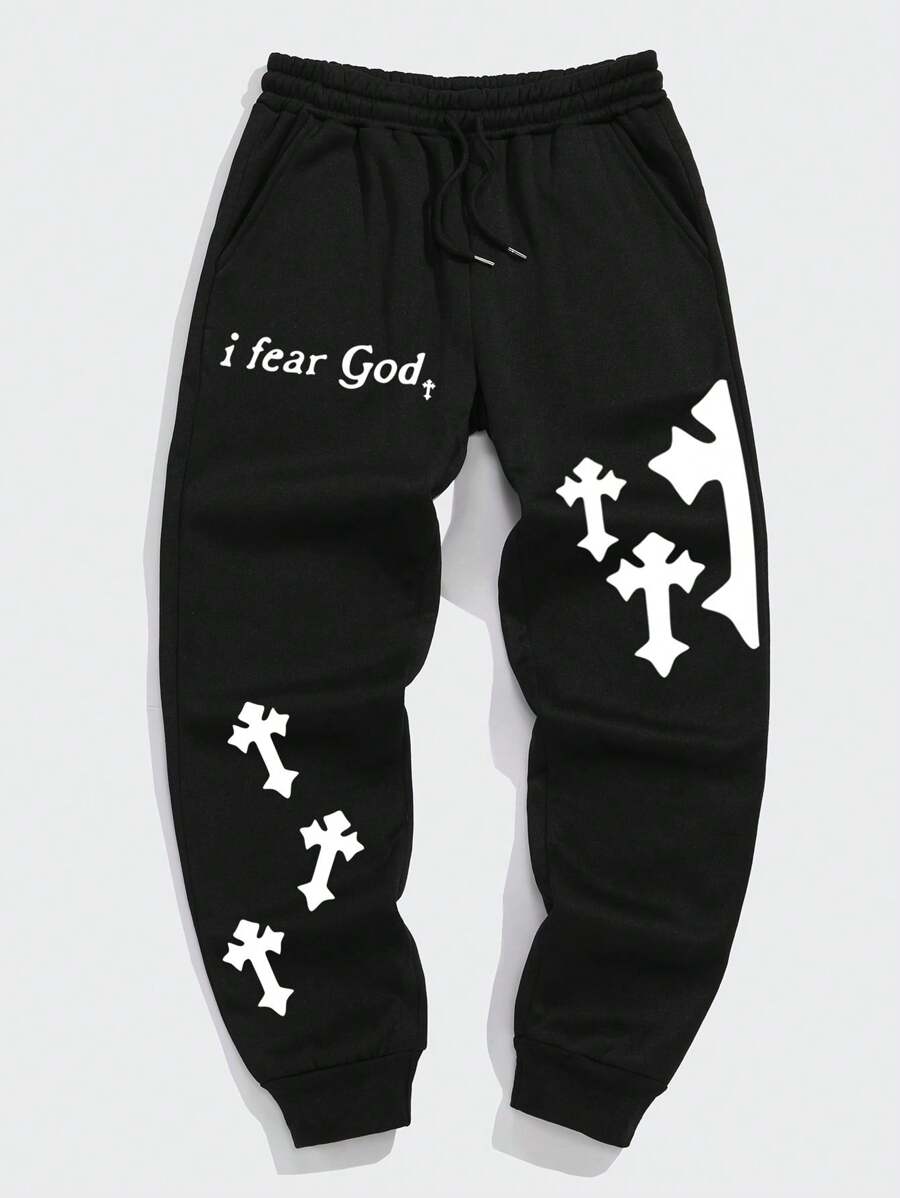Manfinity Dauomo Pantalones jogger para hombre con diseño estampado de lema, cintura con cordón, bolsillos y bajo con puño para rave