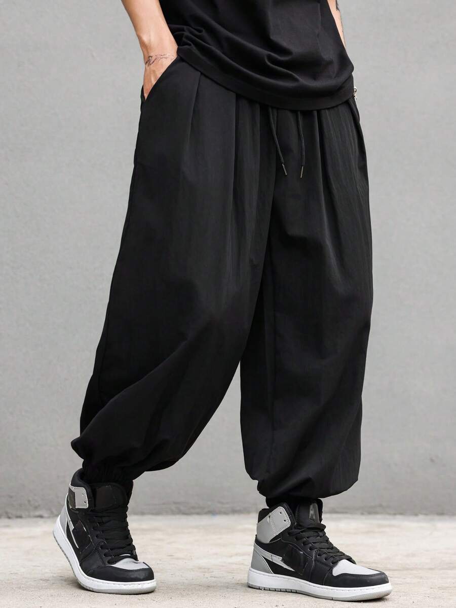 Manfinity EMRG Pantaloni jogger da uomo con coulisse e tasche, pantaloni lunghi tinta unita oversize neri, adatti come regalo per marito o fidanzato, per il ritorno a scuola