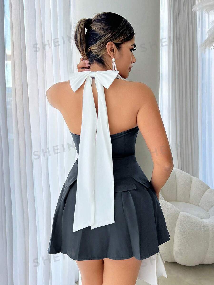 SHEIN SXY Conjunto de chaleco sin mangas con escote en V en la espalda y falda con decoración de lazo, 2 piezas