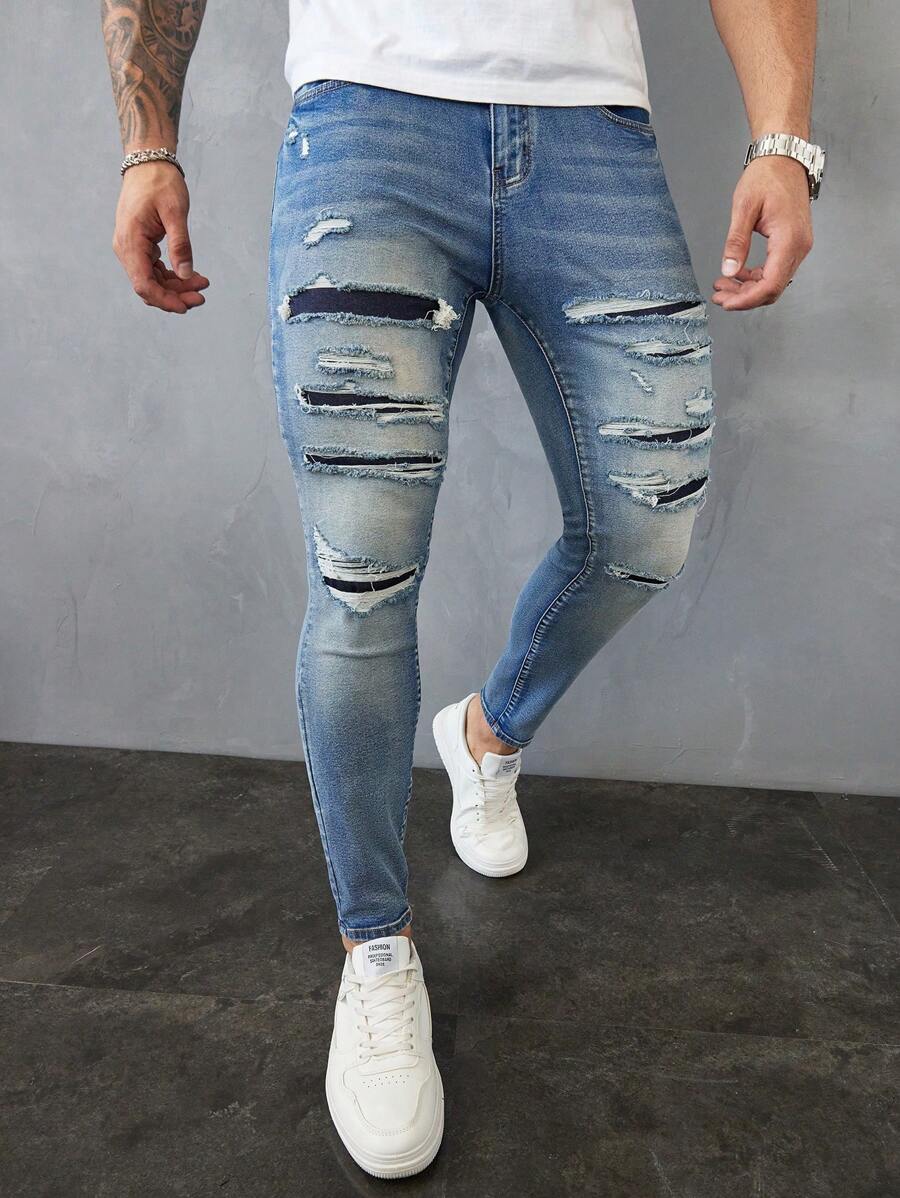Manfinity LEGND Jeans vaqueros slim fit de hombre de color azul claro lavado y desgastado