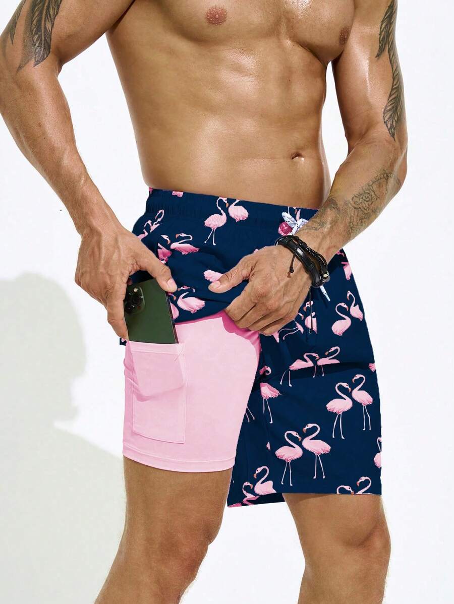 Manfinity Swimmode Bañadores sueltos y tipo short con estampado de flamencos para vacaciones de verano de los hombres, con forro de seda de leche, estilo hawaiano