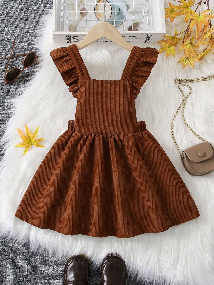 Young Girl Brown Strap Dress, Made Of Classic Corduroy Fabric, Stylish And Warm. The Strap And Ruffle Design Add Sweetness, Suitable For Casual Daily Wear And Outdoor Activities, Fit For Autumn/Winter Season