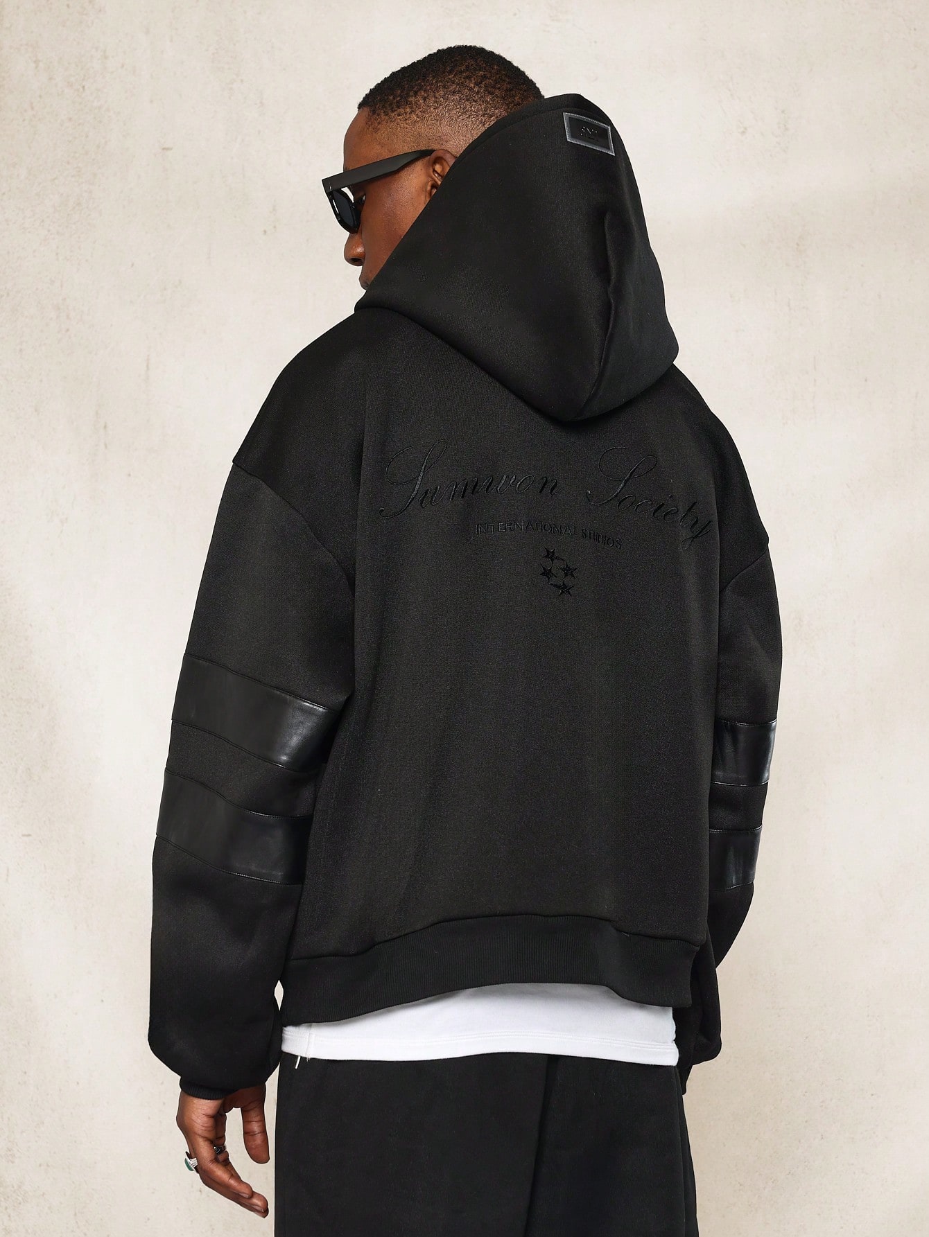 Luxury Streetwear Hoodie With Faux Leather Panel Design