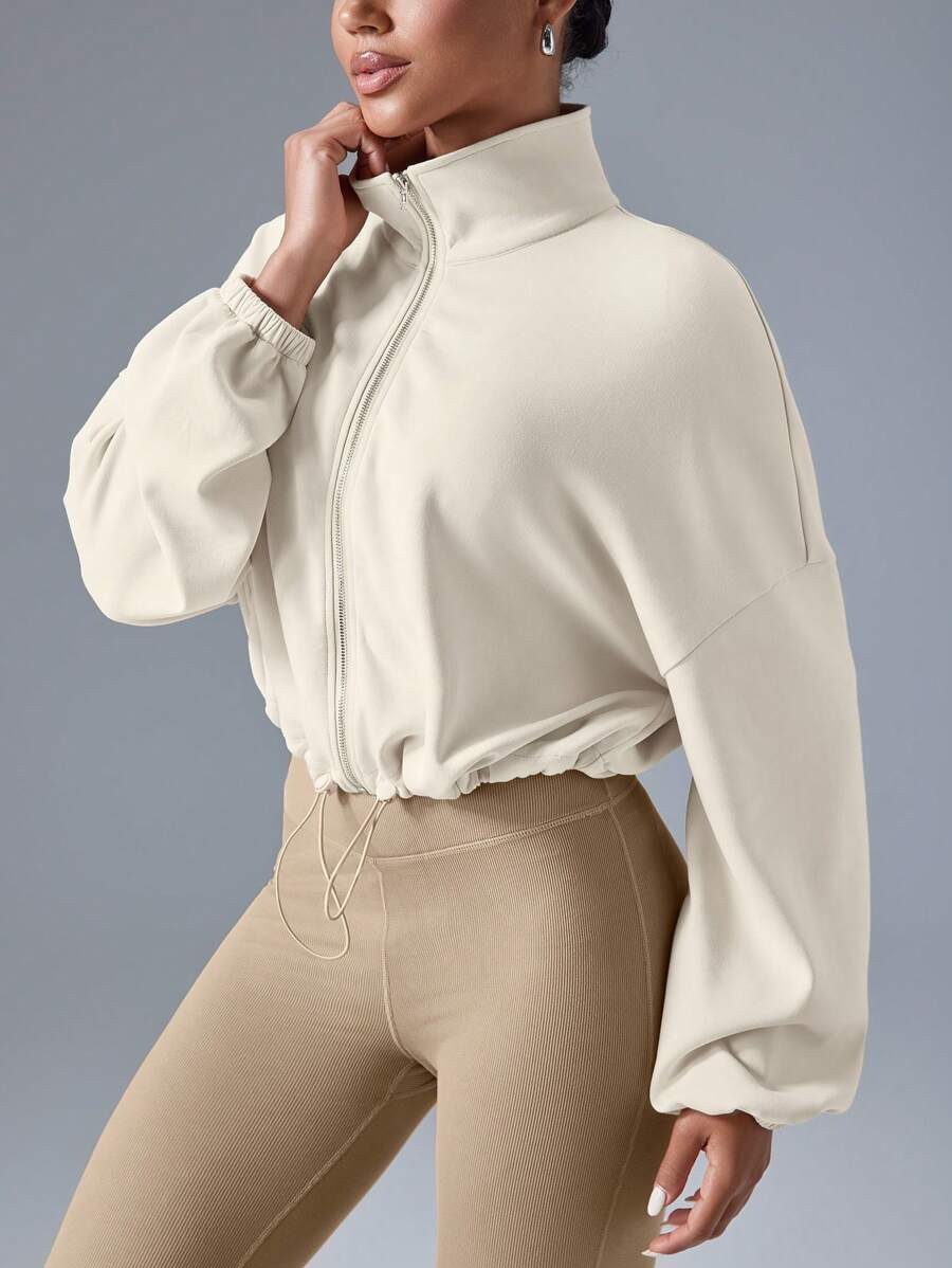 VARSITIE Chaqueta deportiva para mujer de manga larga, cuello alto, hombros caídos y corte holgado en unicolor