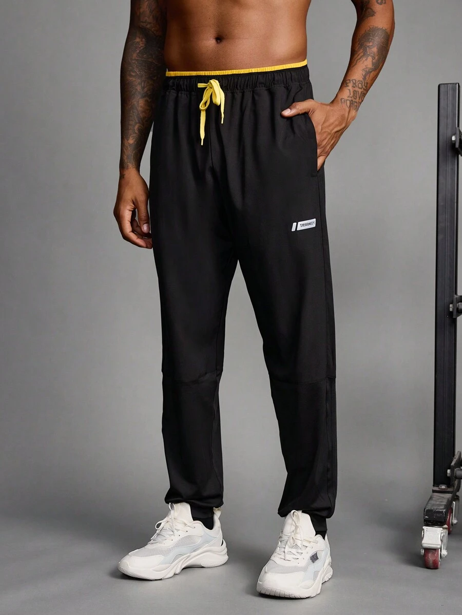 Manfinity Sport Streetwear Boyfriend Style Men's Contrast Color Patchwork Front Tie Pocket Minimalist Sports Pants