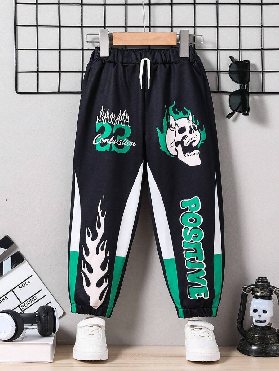 SHEIN 1 pieza Pantalones informales con cordón y puños para niños pequeños, con diseño de bloques de color, numérico y calavera, cómodos y transpirables para uso diario, juegos al aire libre, ir a la escuela y fiestas de otoño/invierno y Halloween