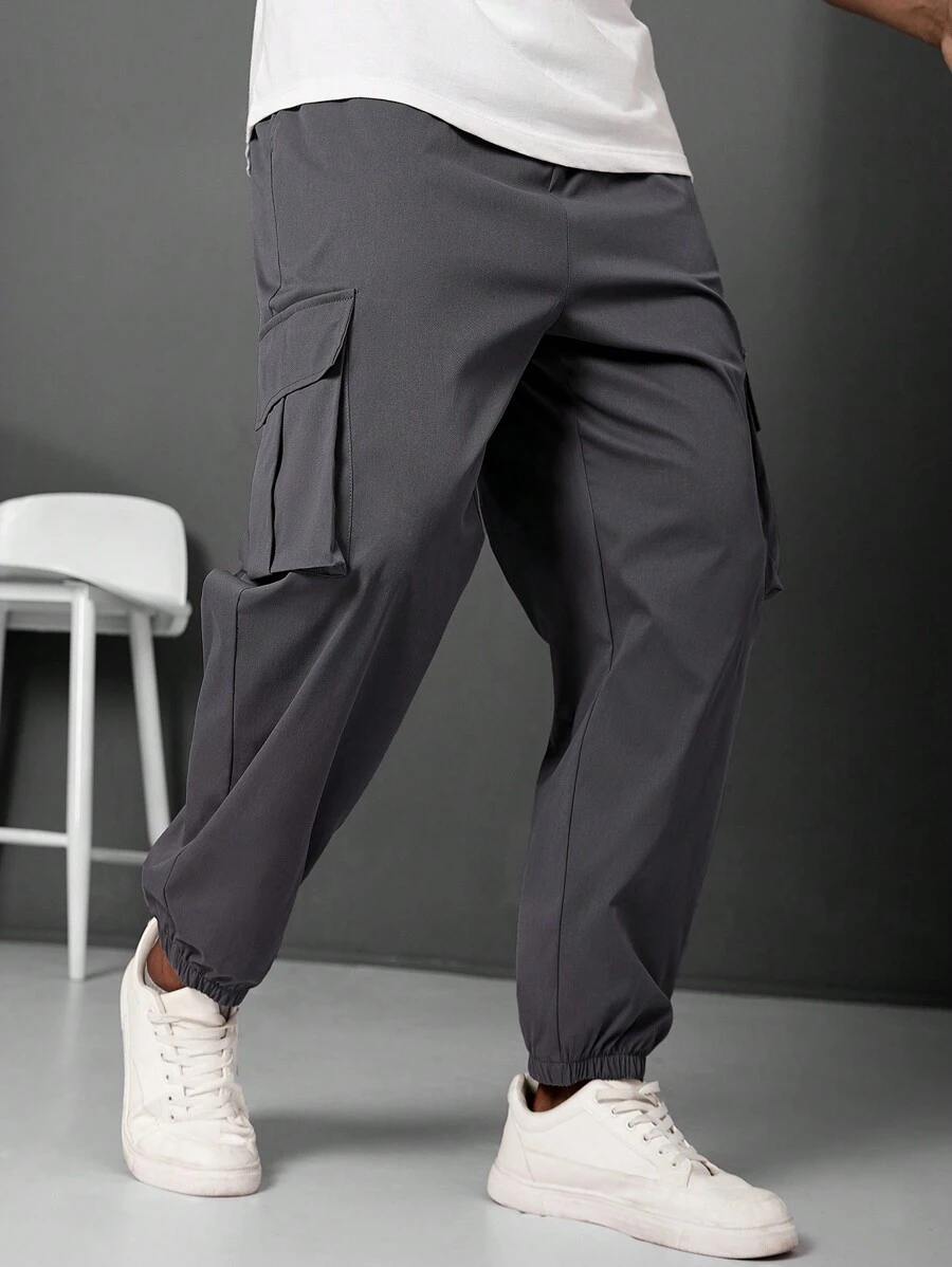 Manfinity LEGND Pantalones jogger informales para hombre talla grande con parche con letra y bolsillo cargo