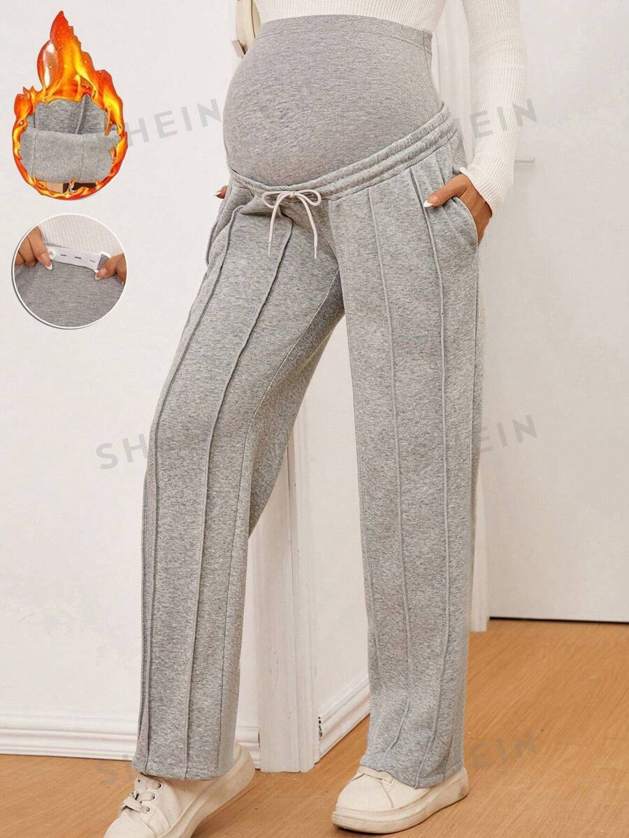 SHEIN Pantalones casuales rectos holgados con diseño de raya de unicolor y cintura ajustable para maternidad
