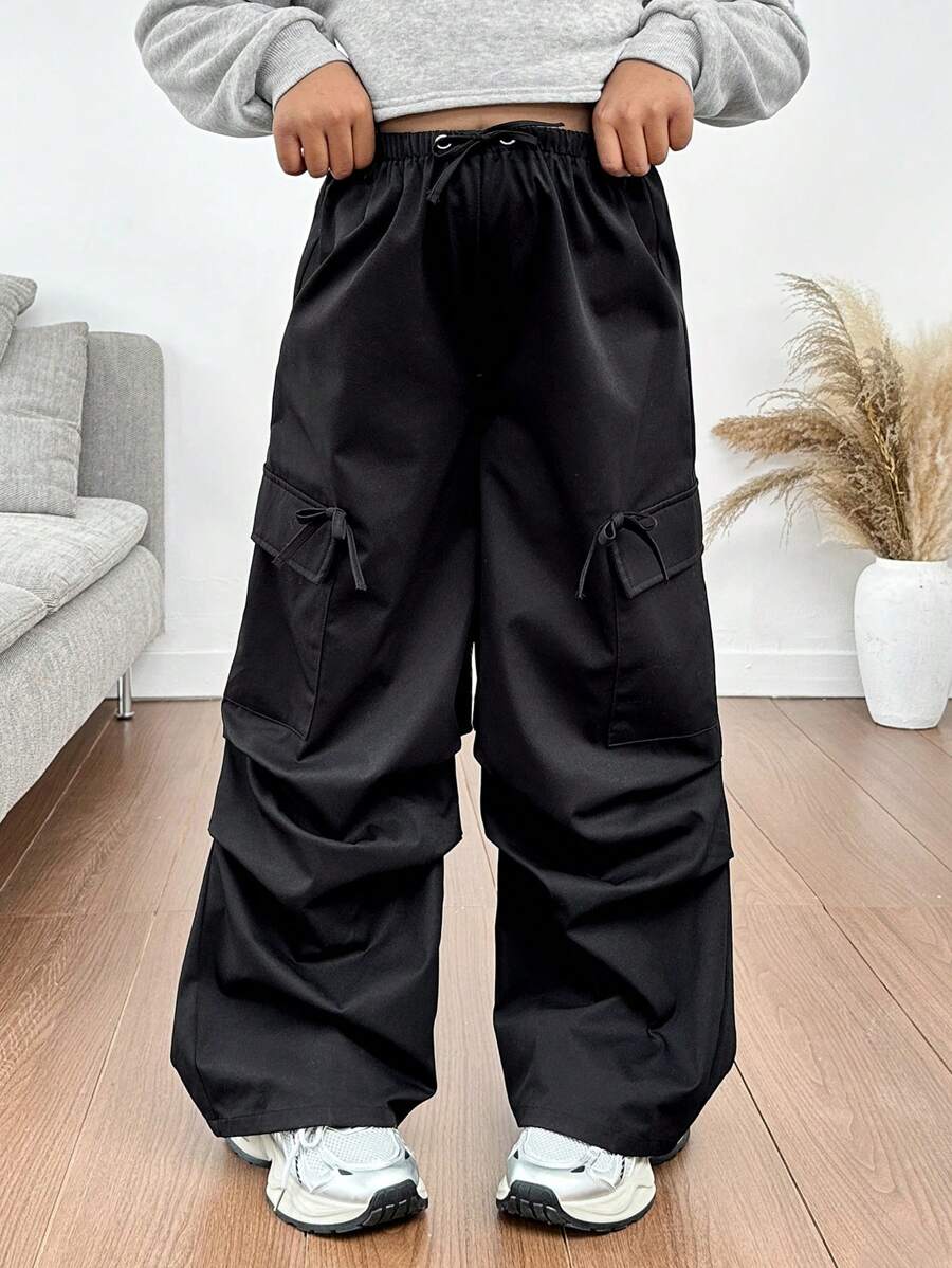 SHEIN Pantalones holgados informales de carga de estilo llamativo con bolsillos de cinta de contraste de color para niñas preadolescentes