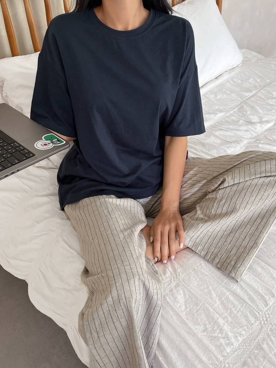 DAZY Conjunto de pijama de 2 piezas con camiseta de cuello redondo de hombros caídos y pantalones acanalados de unicolor para mujer