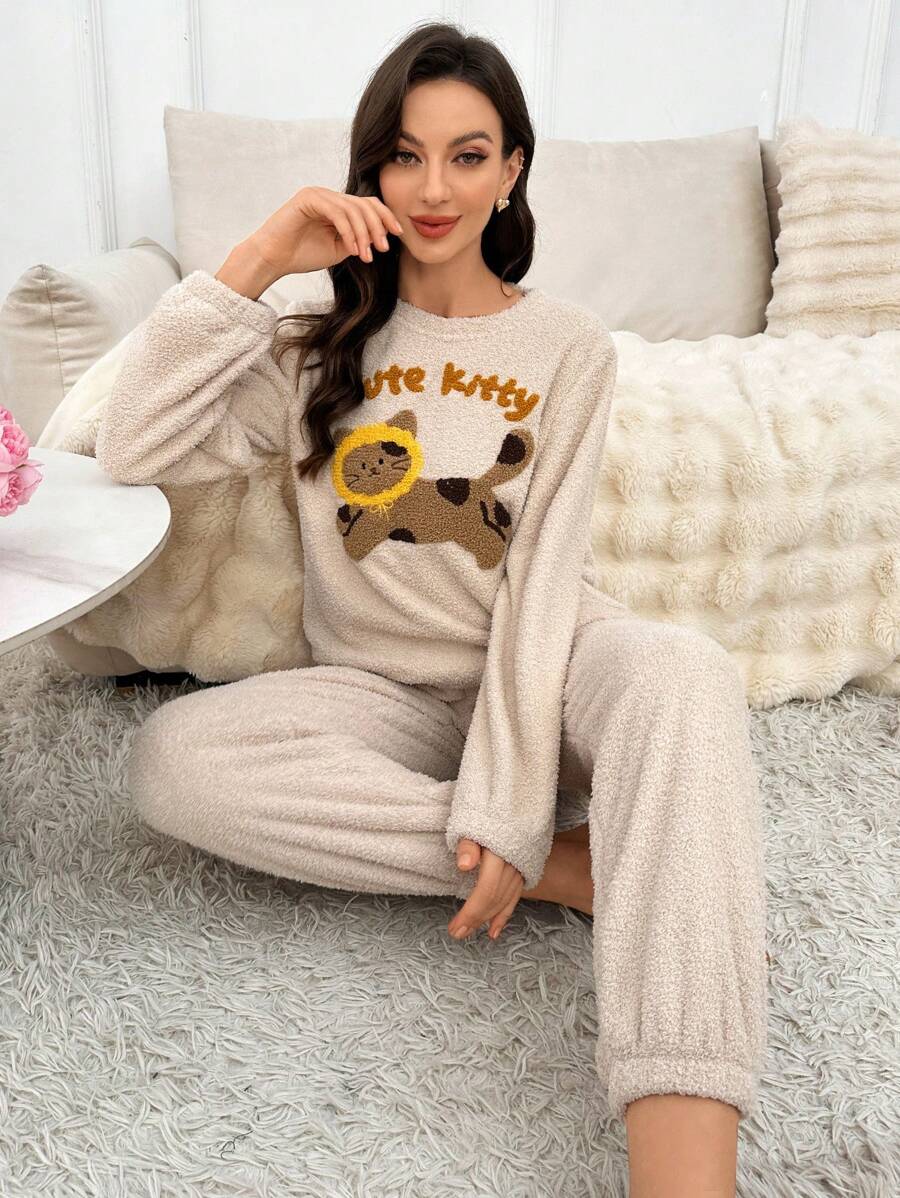 Pijama de mujer informal con parte superior de manga larga con cuello redondo y estampado de letras y gato de dibujos animados, y pantalones