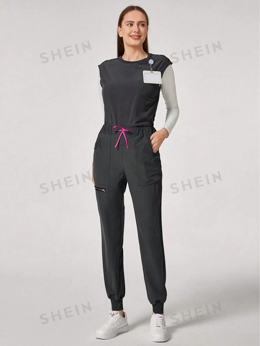 TaskEZ Conjunto informal de uniforme de scrubs con top cuello redondo minimalista y pantalón de chándal con bolsillo