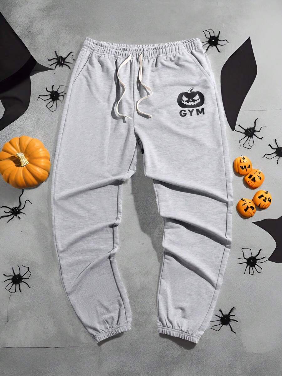 Manfinity Fitness Spodnie dresowe męskie w stylu Boyfriend Casual z nadrukiem w dynię i wiązaniem z przodu