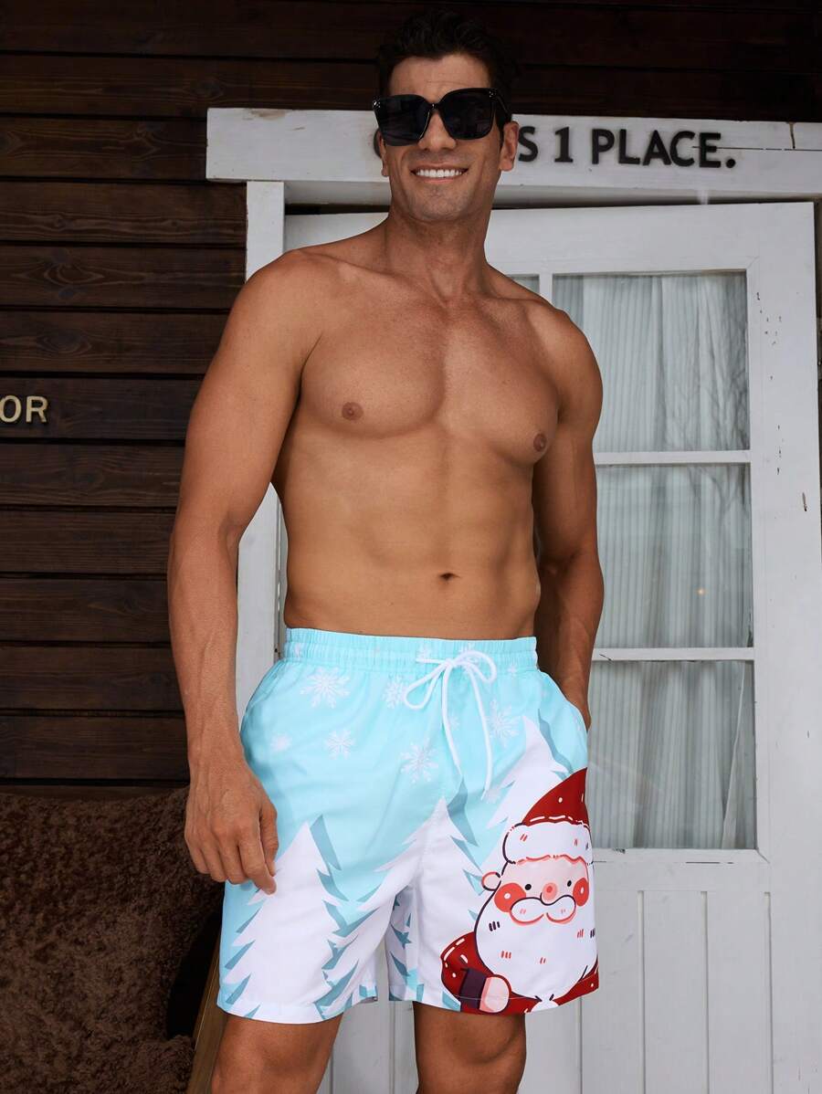 Manfinity Swimmode Pantalones cortos de playa con cordón en la cintura, bolsillos laterales y estampado de Papá Noel y copos de nieve para hombre, verano